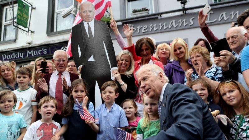 Joe Biden posing for a photo with residents in Ballina in 2016